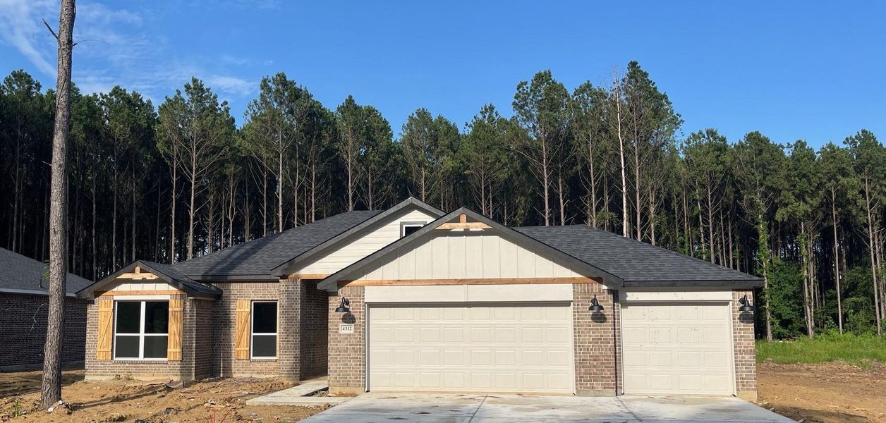 Front exterior of a new home in , Dayton, TX, highlighting curb appeal (Image 1). Front exterior of a new home in , Dayton, TX, highlighting curb appeal (Image 1).
