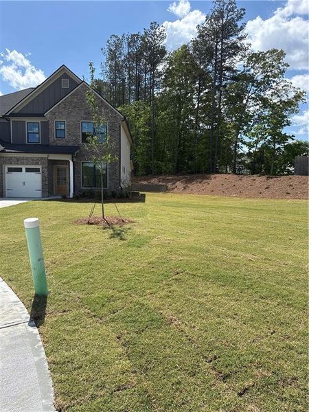 Front exterior of a new home in , Lawrenceville, GA, highlighting curb appeal (Image 9).