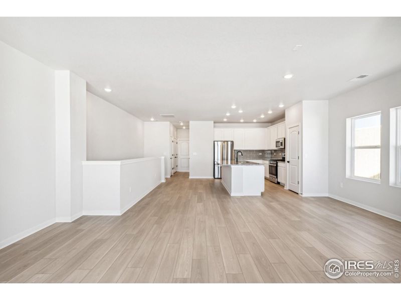 Spacious, unfurnished interior of a new home in Kinston Mainstreet Townhomes, Loveland (Image 17).