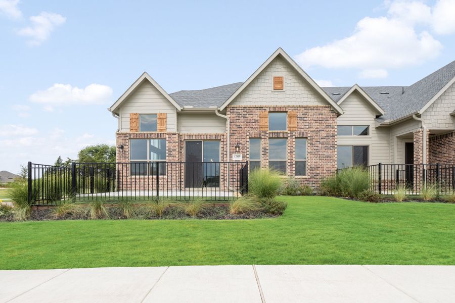 Front exterior of a new home in Cottonwood Creek, Rowlett, TX, highlighting curb appeal (Image 27).