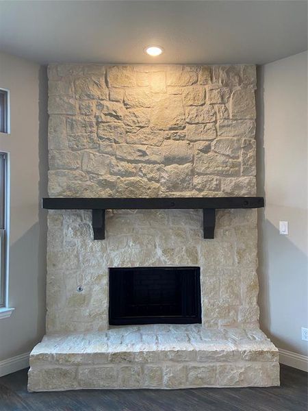 Gas Stone fireplace to the ceiling with cedar mantle