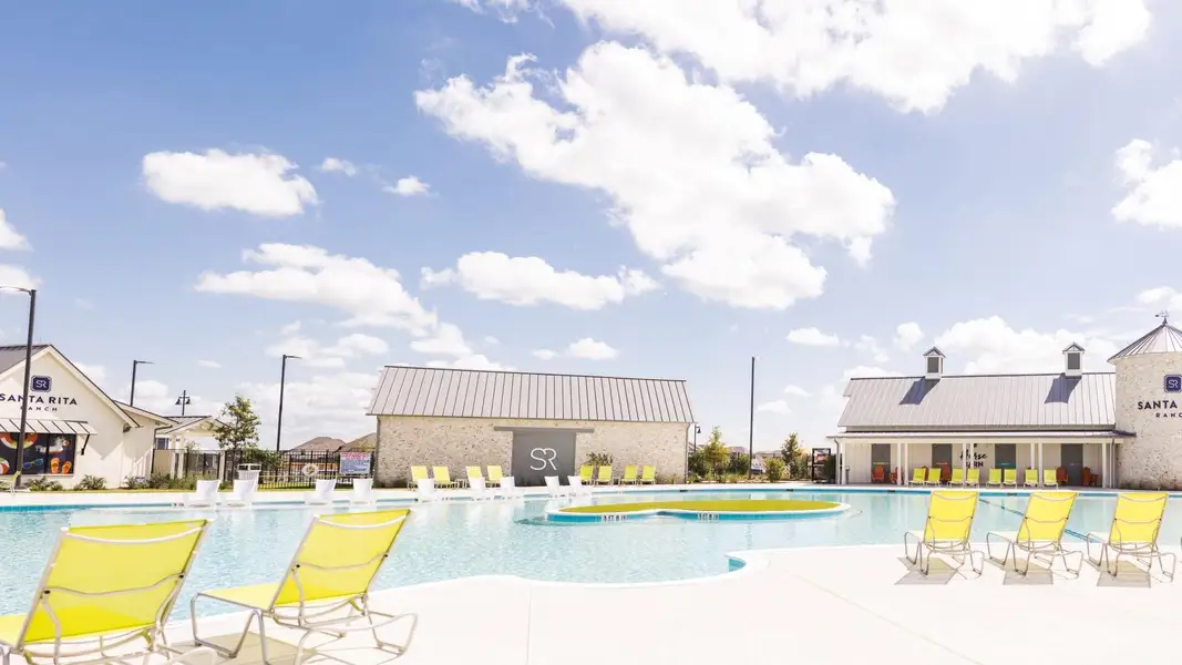 Community pool featuring a patio