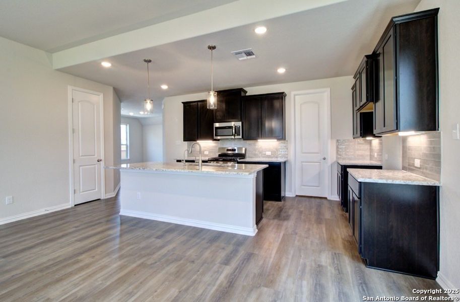 Furnished interior view inside a new home in Stream Waters, Seguin (Image 9).
