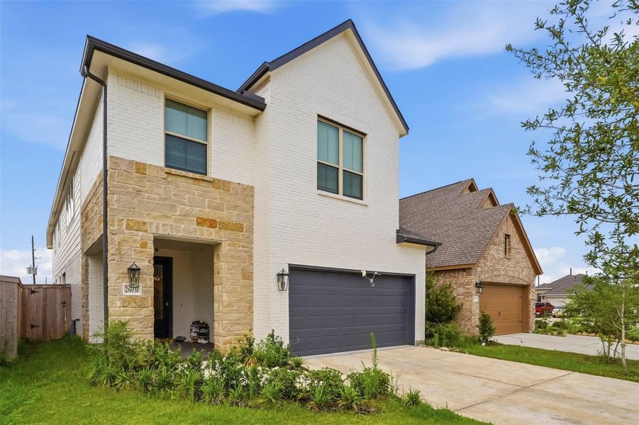 Front exterior of a new home in Candela, Richmond, TX, highlighting curb appeal (Image 2). Front exterior of a new home in Candela, Richmond, TX, highlighting curb appeal (Image 2).