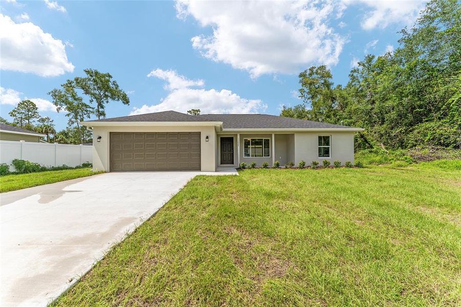 Front exterior of a new home in , Silver Springs, FL, highlighting curb appeal (Image 21).