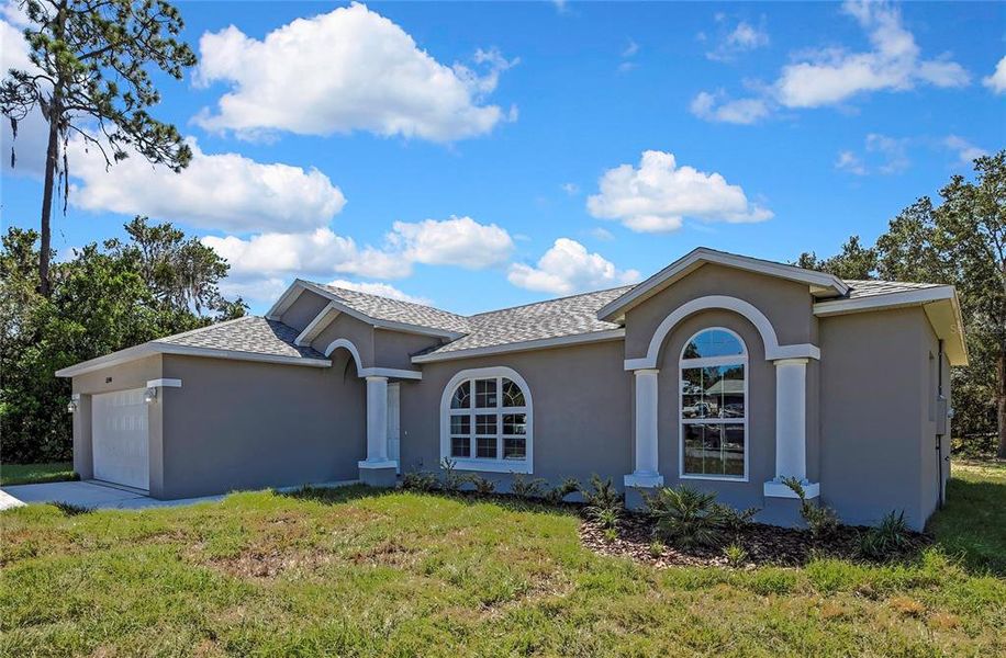 Front exterior of a new home in , Brooksville, FL, highlighting curb appeal (Image 20).