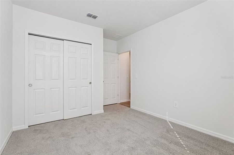 Spacious, unfurnished interior of a new home in Lake Deer Estates - Signature Series, Poinciana (Image 26).