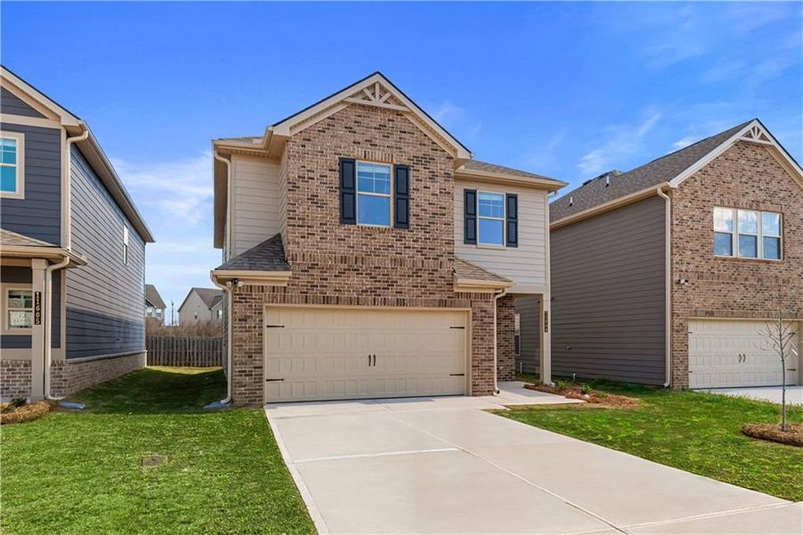 Front exterior of a new home in Towne Center, Hampton, GA, highlighting curb appeal (Image 23).