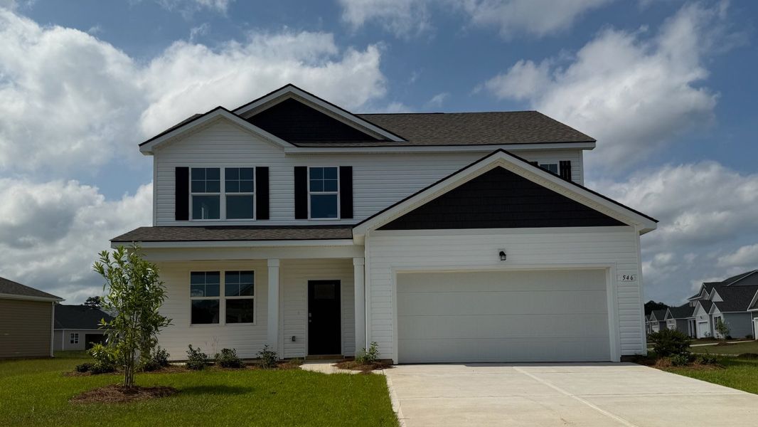 Front exterior of a new home in Eden Springs, Longs, SC, highlighting curb appeal (Image 1).