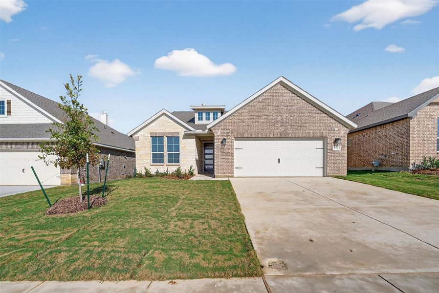 Front exterior of a new home in Liberty Pointe, Gainesville, TX, highlighting curb appeal (Image 2).