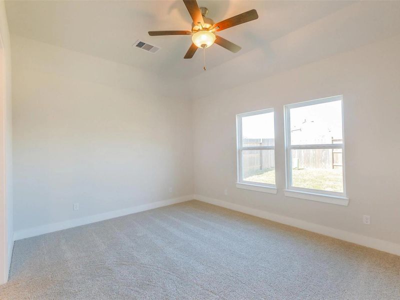 Spacious, unfurnished interior of a new home in Sunterra, Katy (Image 26).