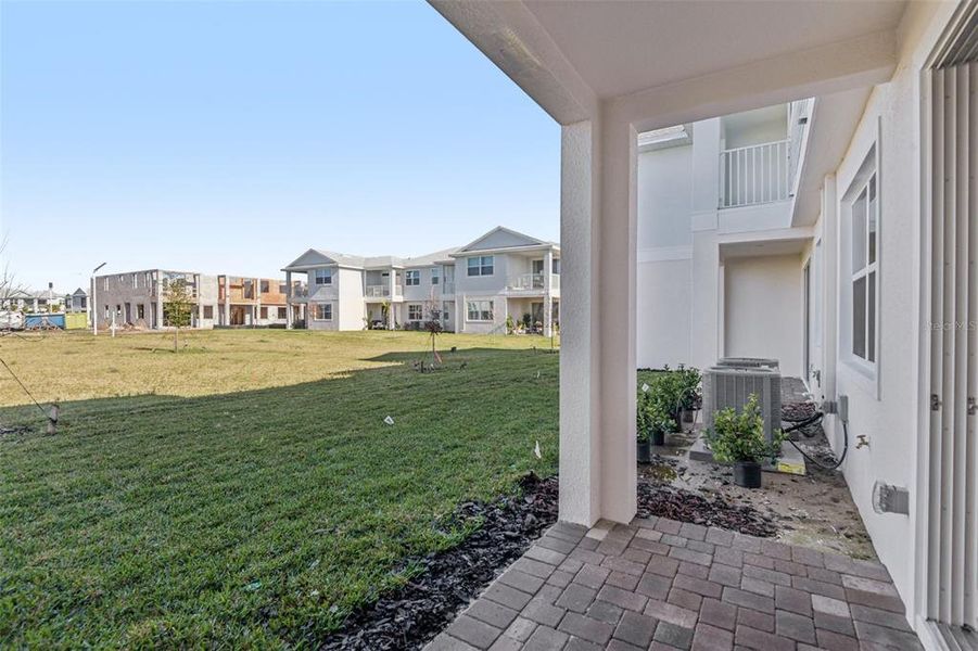 Exterior details and patio area of a home in Lagoon Residences at Epperson, Wesley Chapel (Image 29).