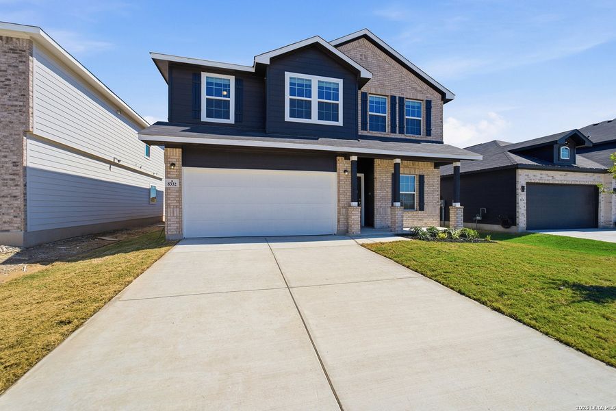 Front exterior of a new home in Red Hawk Landing, San Antonio, TX, highlighting curb appeal (Image 16). Front exterior of a new home in Red Hawk Landing, San Antonio, TX, highlighting curb appeal (Image 16).