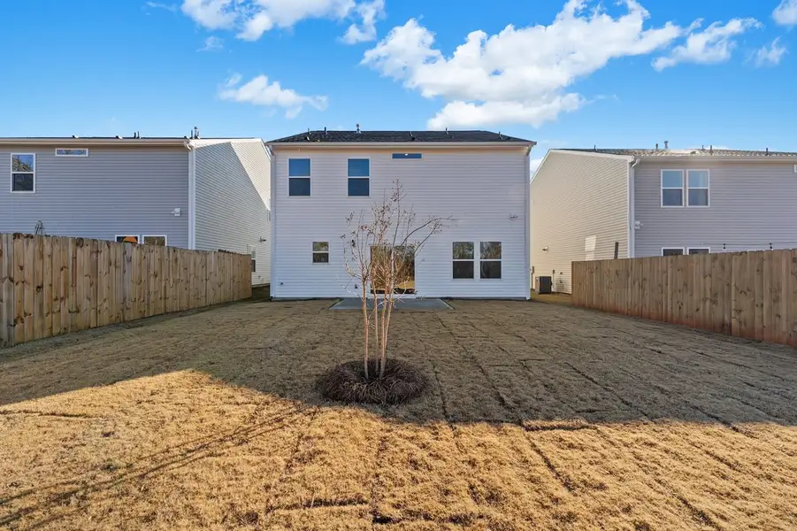 Exterior details and patio area of a home in Richmond Hill, Inman (Image 3).
