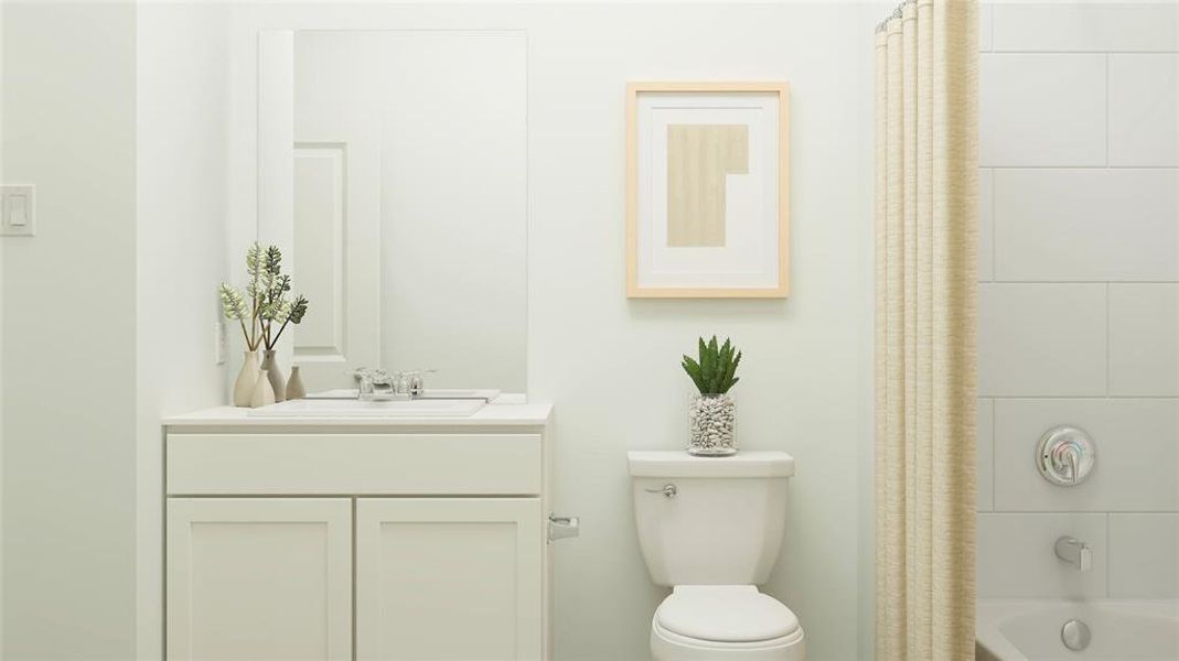 Full bathroom featuring shower / bath combo, vanity, and toilet