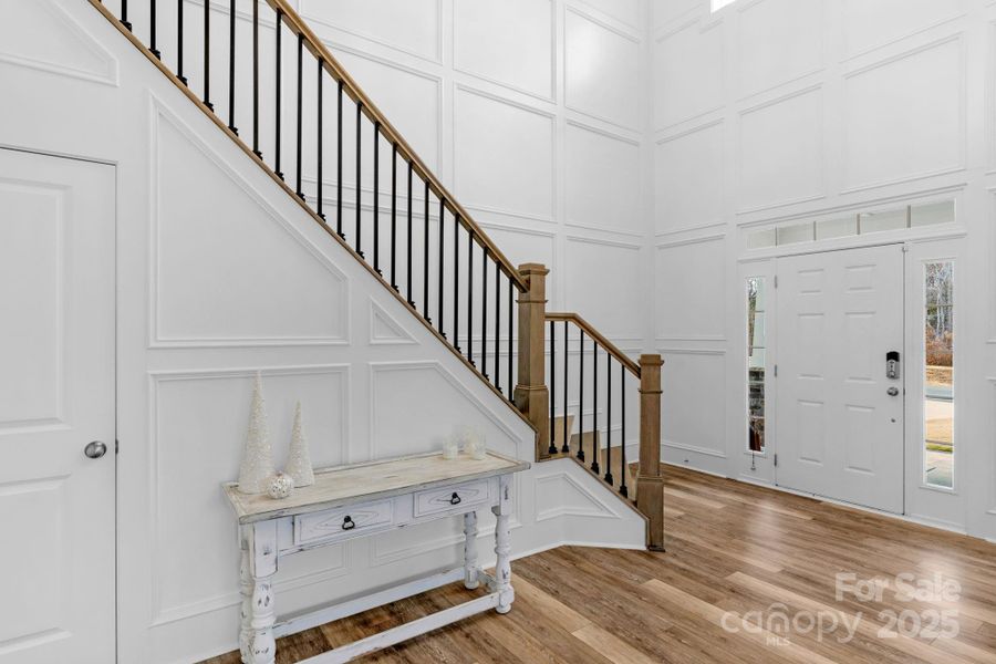 Elegant 2-story foyer with custom picture-frame molding