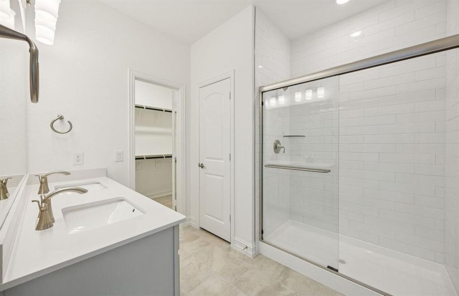 Full walk-in shower in owner's suite