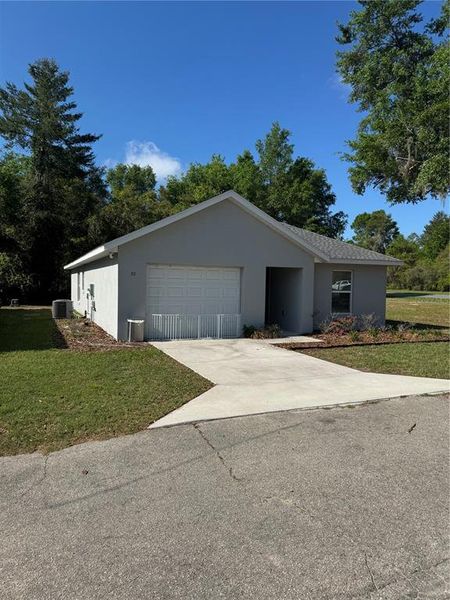 Front exterior of a new home in , Summerfield, FL, highlighting curb appeal (Image 1). Front exterior of a new home in , Summerfield, FL, highlighting curb appeal (Image 1).