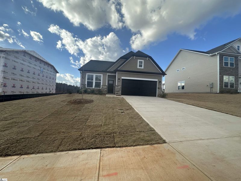 Front exterior of a new home in Shiloh Trail, Wellford, SC, highlighting curb appeal (Image 24). Front exterior of a new home in Shiloh Trail, Wellford, SC, highlighting curb appeal (Image 24).