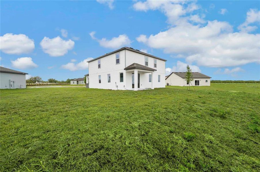 Exterior details and patio area of a home in Citrus Place, Babson Park (Image 4).