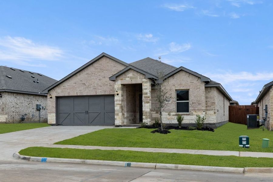 Representative exterior photo of a completed home built from the Lexington by Impression Homes in Baker Farms, Cleburne, TX (Image 2).