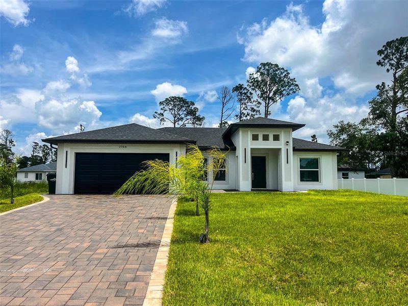 Front exterior of a new home in , North Port, FL, highlighting curb appeal (Image 21).