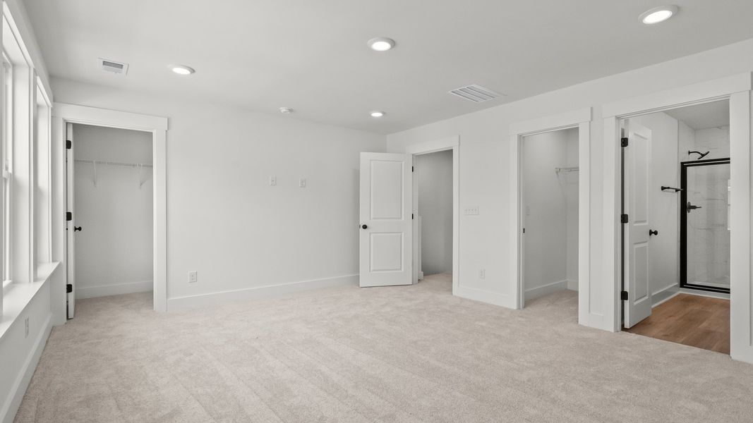 The Brookgreen primary suite at Seabreeze offers space, style, and everyday luxury.