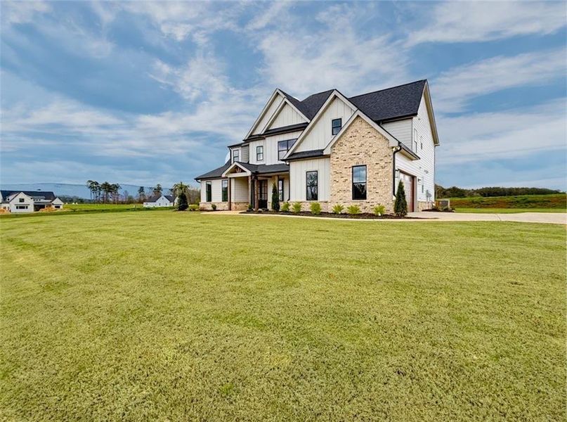 Front exterior of a new home in , Rydal, GA, highlighting curb appeal (Image 30). Front exterior of a new home in , Rydal, GA, highlighting curb appeal (Image 30).
