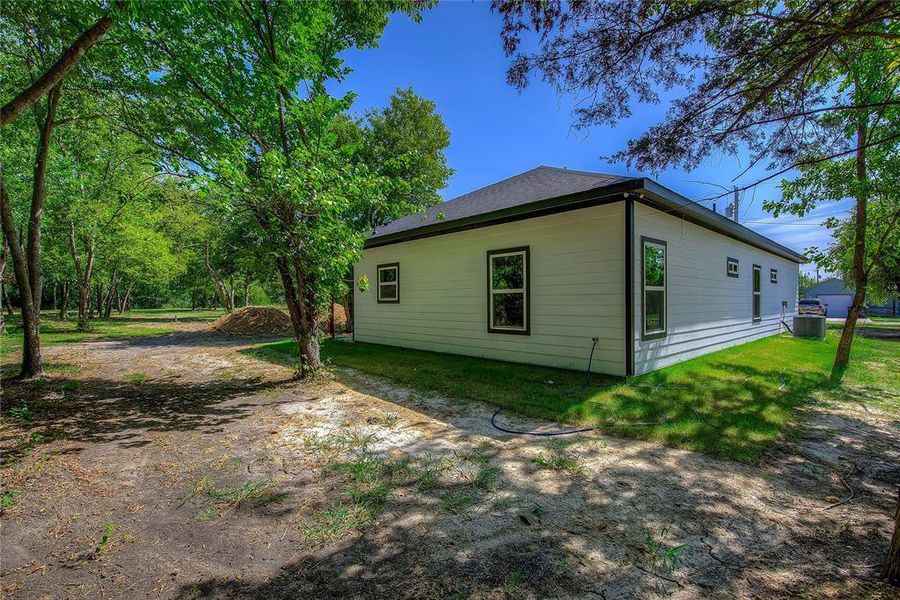 Front exterior of a new home in , Greenville, TX, highlighting curb appeal (Image 20). Front exterior of a new home in , Greenville, TX, highlighting curb appeal (Image 20).
