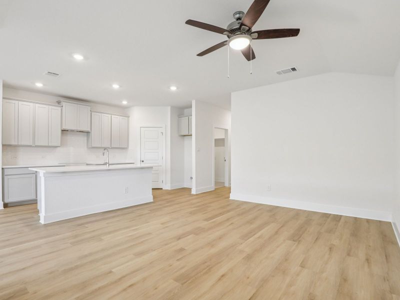 Living & kitchen in the Callaghan floorplan at a Meritage Homes community.