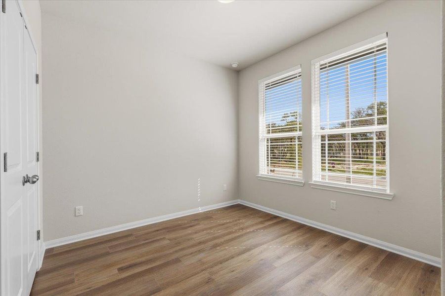 Intentionally planned for privacy, the second bedroom is found on the opposite corner of the house from the primary suite.