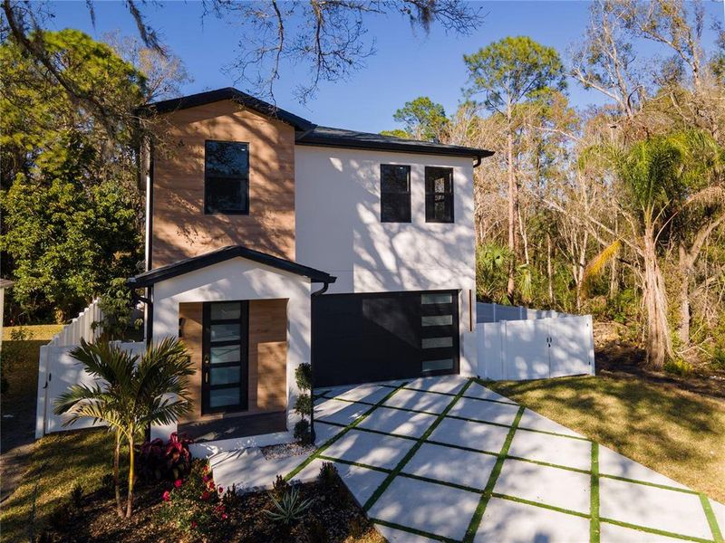 Front exterior of a new home in , Tampa, FL, highlighting curb appeal (Image 28). Front exterior of a new home in , Tampa, FL, highlighting curb appeal (Image 28).