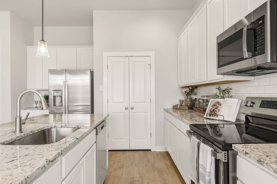 Representative furnished interior of a home built from the The Azalea by Avonley Homes in Pinemont, Bryan (Image 6).