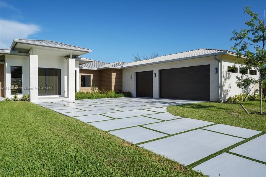 Front exterior of a new home in , Homestead, FL, highlighting curb appeal (Image 29).