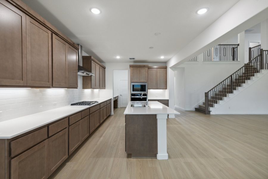 Kitchen in the Presley II home plan by Trophy Signature Homes – REPRESENTATIVE PHOTO