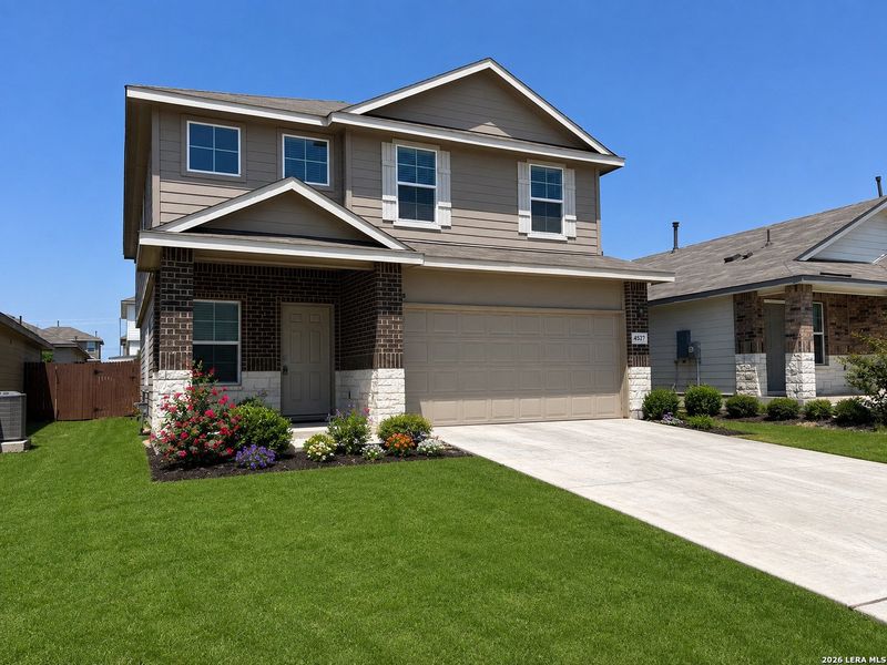 Front exterior of a new home in Avenida, Converse, TX, highlighting curb appeal (Image 21). Front exterior of a new home in Avenida, Converse, TX, highlighting curb appeal (Image 21).