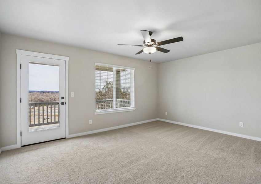 The master bedroom is spacious with a large window.