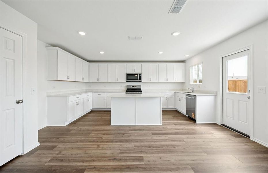 Airy kitchen with ample cabinet space