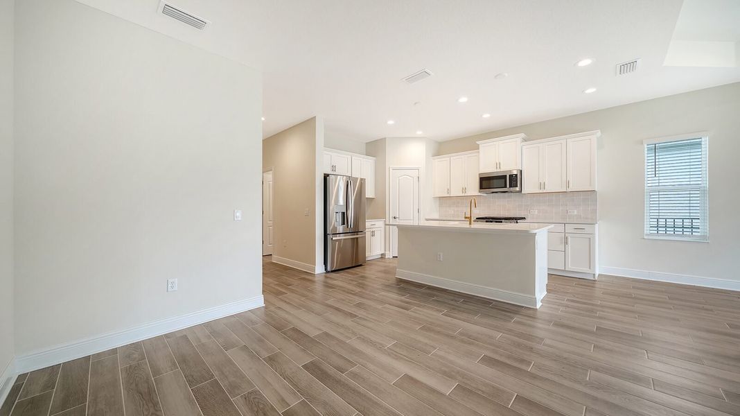 Furnished interior view inside a new home in Wildleaf at North River Ranch, Parrish (Image 12).