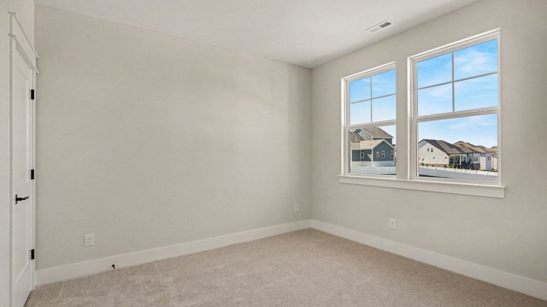 Secondary bedroom with windows and closet Secondary bedroom with windows and closet