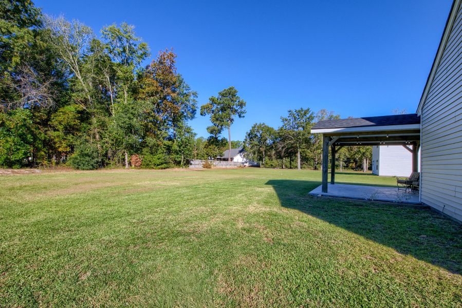 Exterior details and patio area of a home in , Bonneau (Image 24).