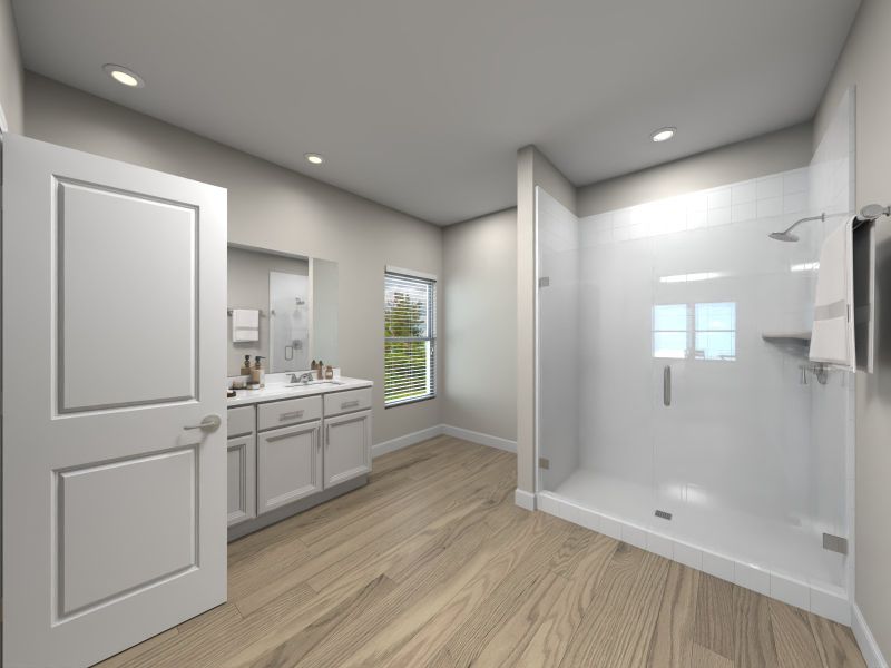 The en suite primary bath boasts dual sinks and a spacious walk in closet. The en suite primary bath boasts dual sinks and a spacious walk in closet.