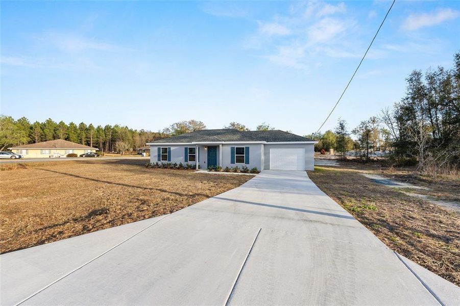 Front exterior of a new home in , Ocala, FL, highlighting curb appeal (Image 2). Front exterior of a new home in , Ocala, FL, highlighting curb appeal (Image 2).