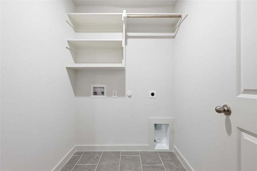 Laundry room with washer hookup, hookup for an electric dryer, and hookup for a gas dryer