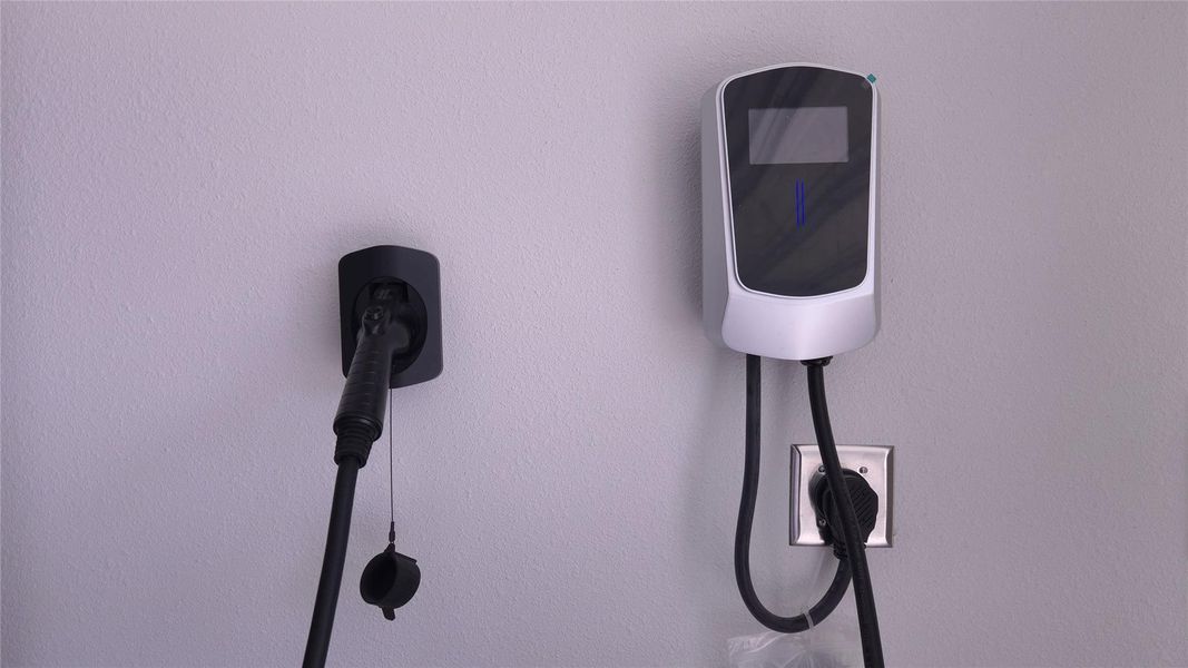 Electric vehicle charging station with integrated display