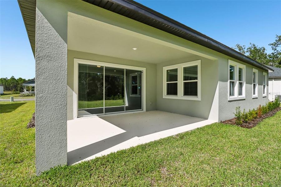 Exterior details and patio area of a home in Ridgehaven - Reserve Series, Ormond Beach (Image 24).