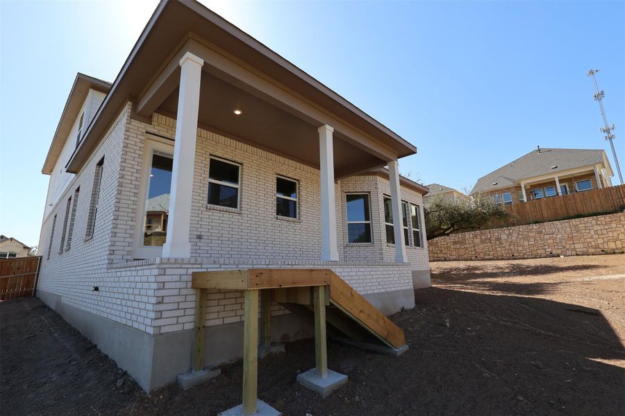 Front exterior of a new home in Edgewood, Leander, TX, highlighting curb appeal (Image 13).