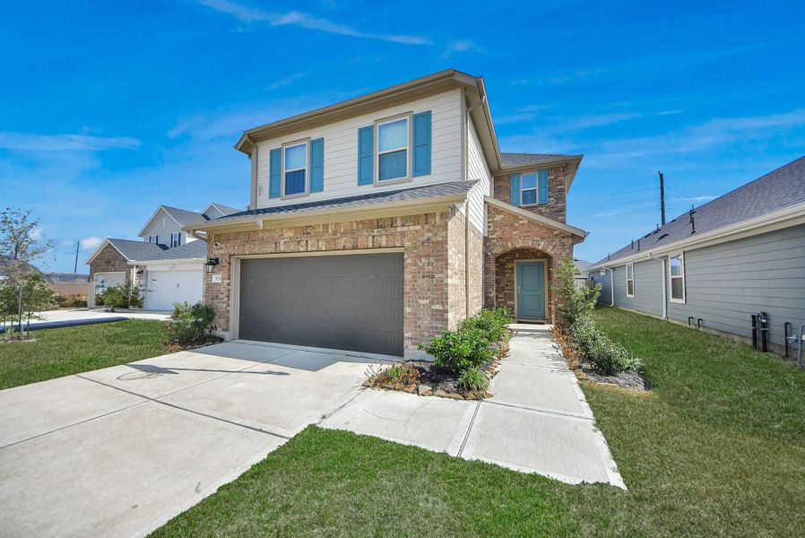Front exterior of a new home in Marisol, Katy, TX, highlighting curb appeal (Image 1). Front exterior of a new home in Marisol, Katy, TX, highlighting curb appeal (Image 1).