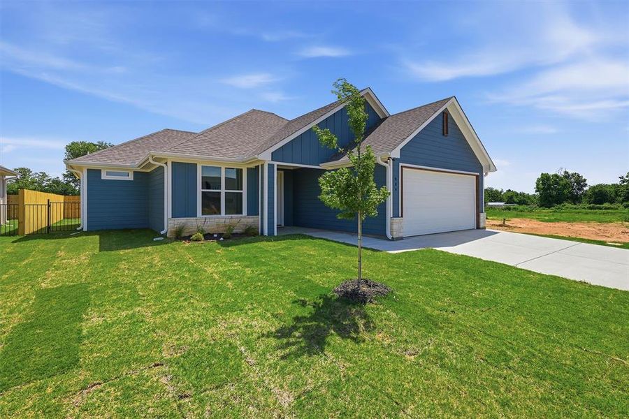 Front exterior of a new home in , Tolar, TX, highlighting curb appeal (Image 27).