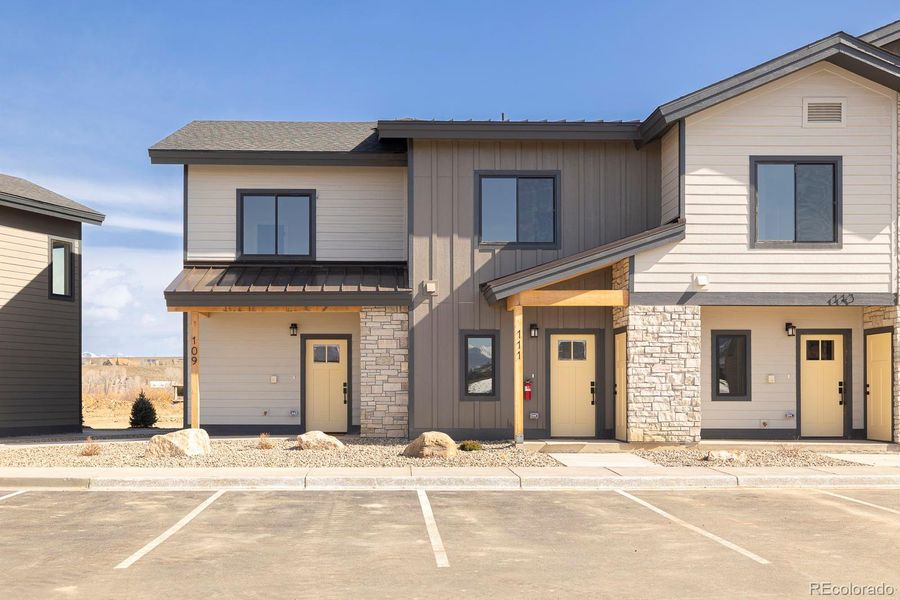 Front exterior of a new home in , Granby, CO, highlighting curb appeal (Image 19). Front exterior of a new home in , Granby, CO, highlighting curb appeal (Image 19).